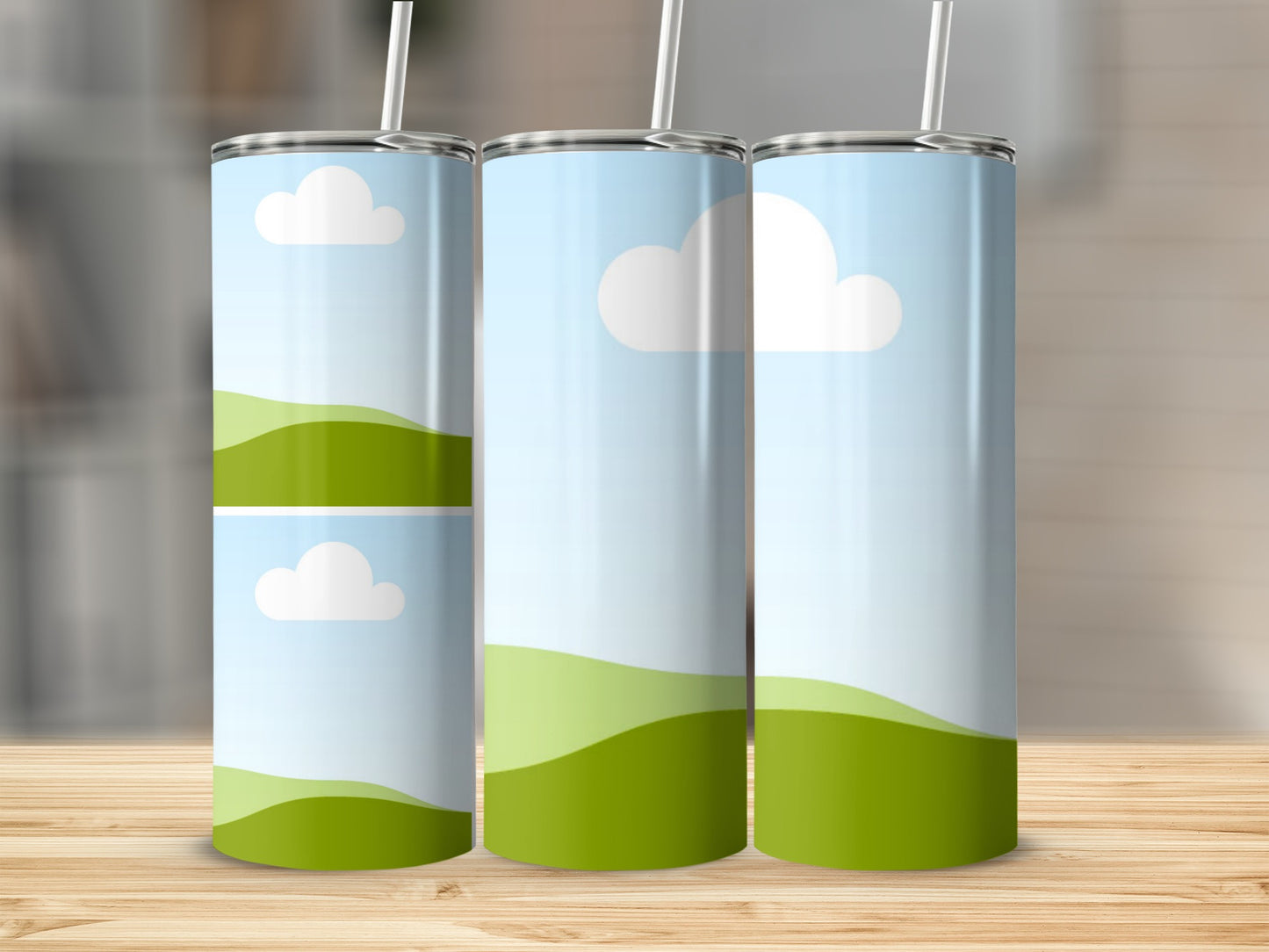Three tumblers with a pastel sky and rolling green hills design.