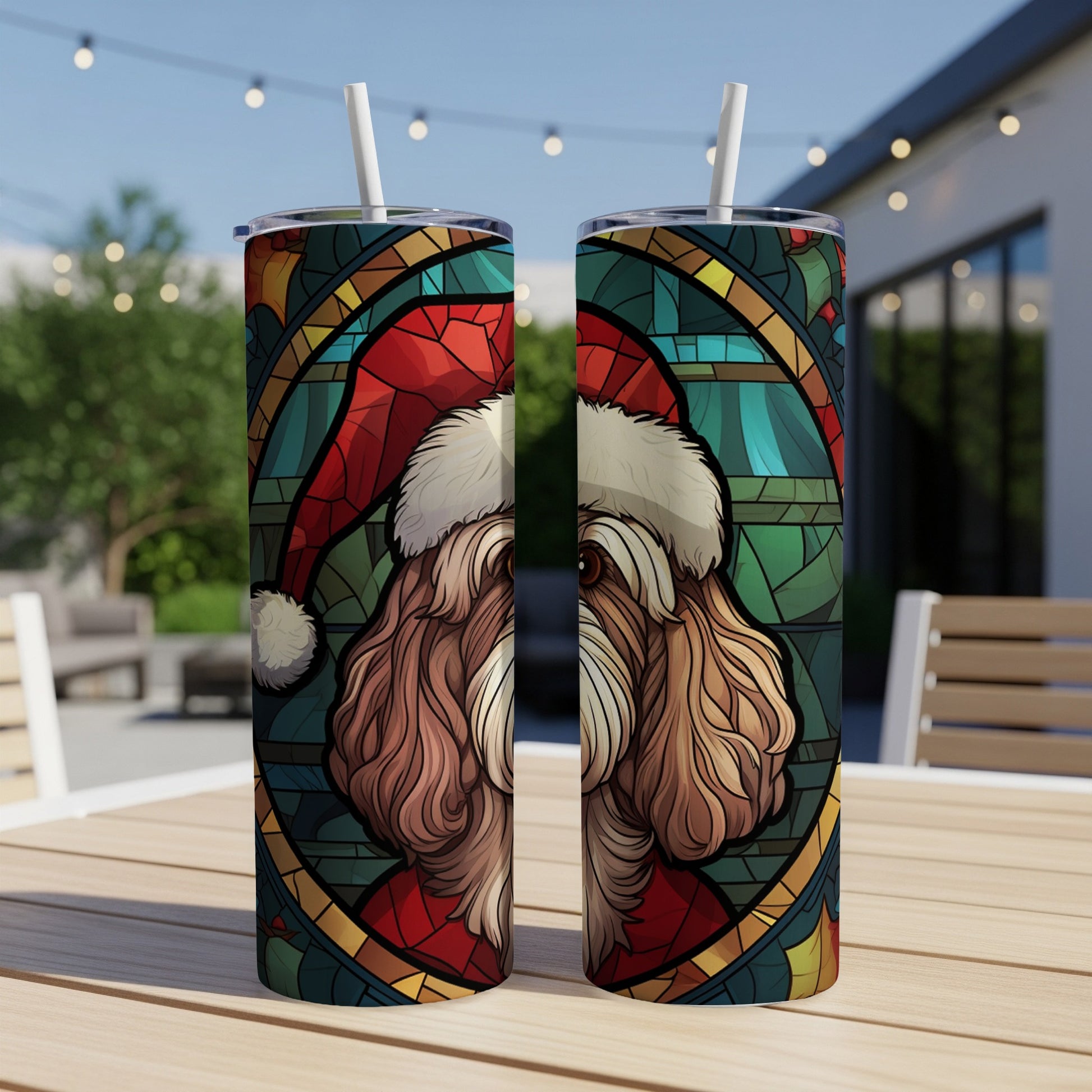 Stained glass dog wearing Santa hat on two tumblers.
