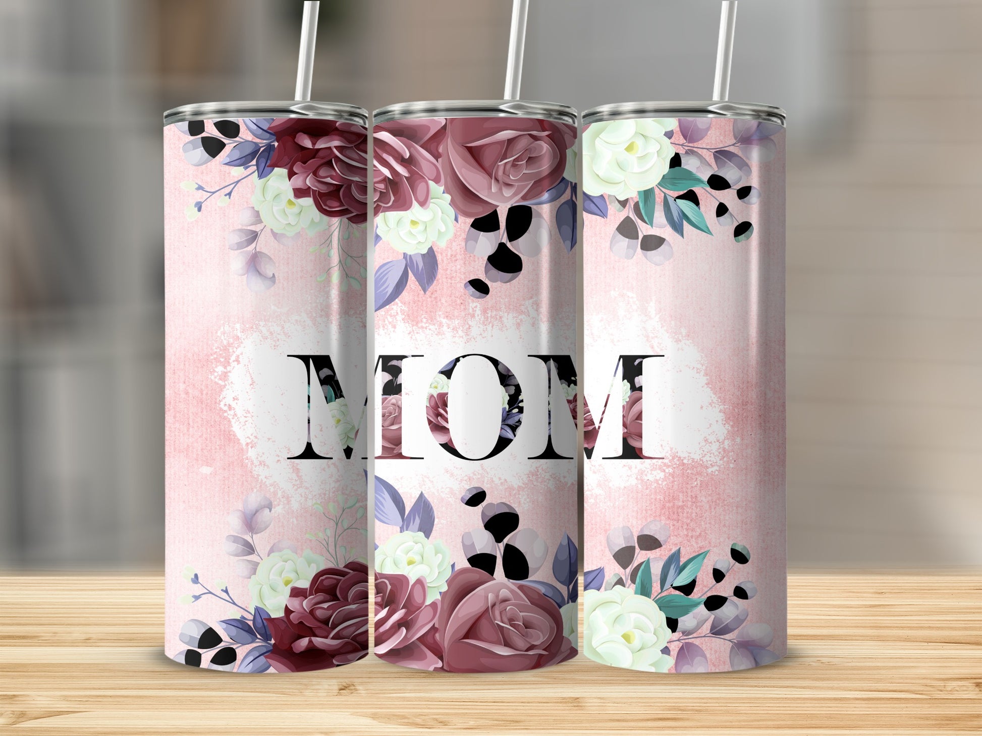 Pink floral tumbler with the word "MOM" in large letters.