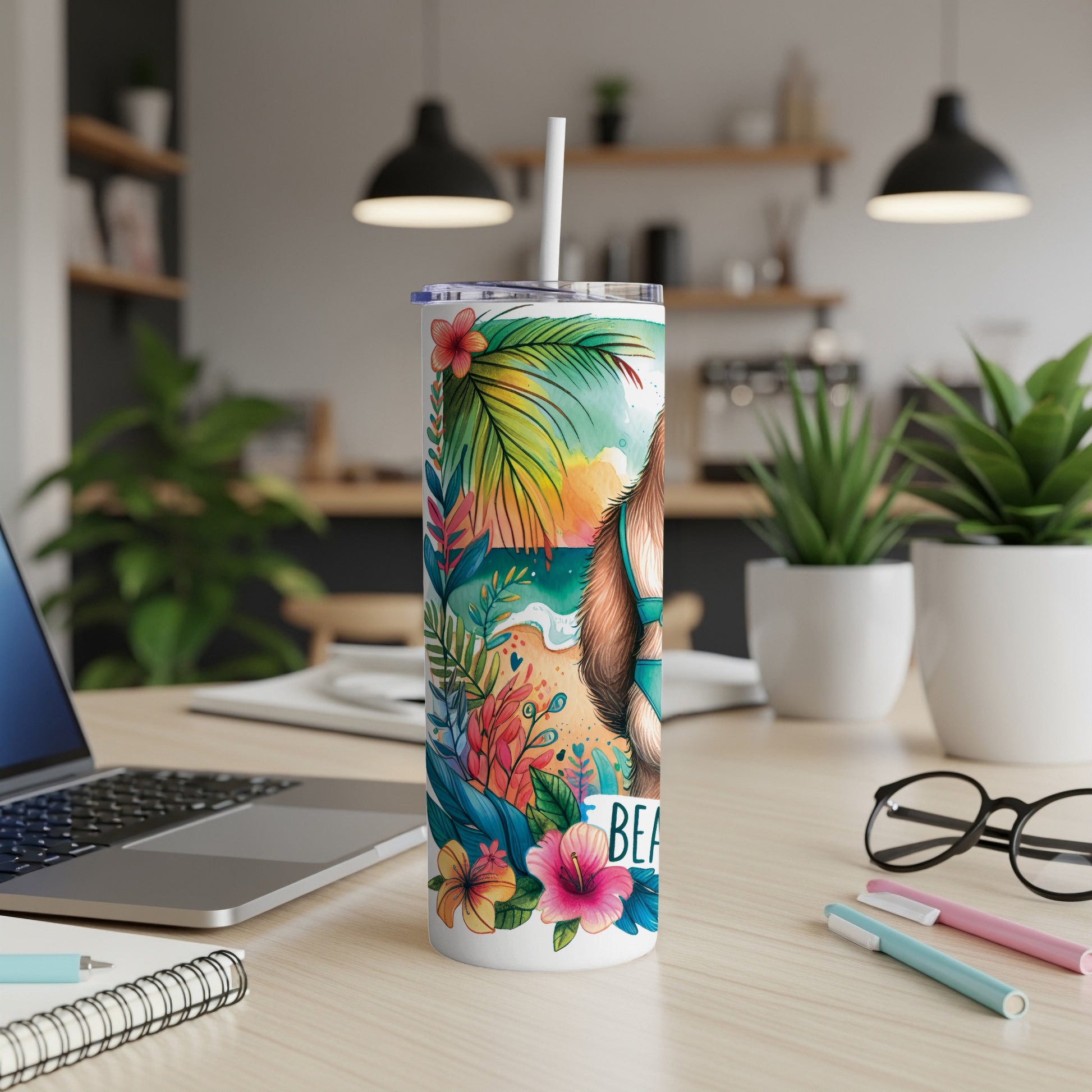 Beach scene tumbler with tropical flowers and a dog wearing sunglasses.