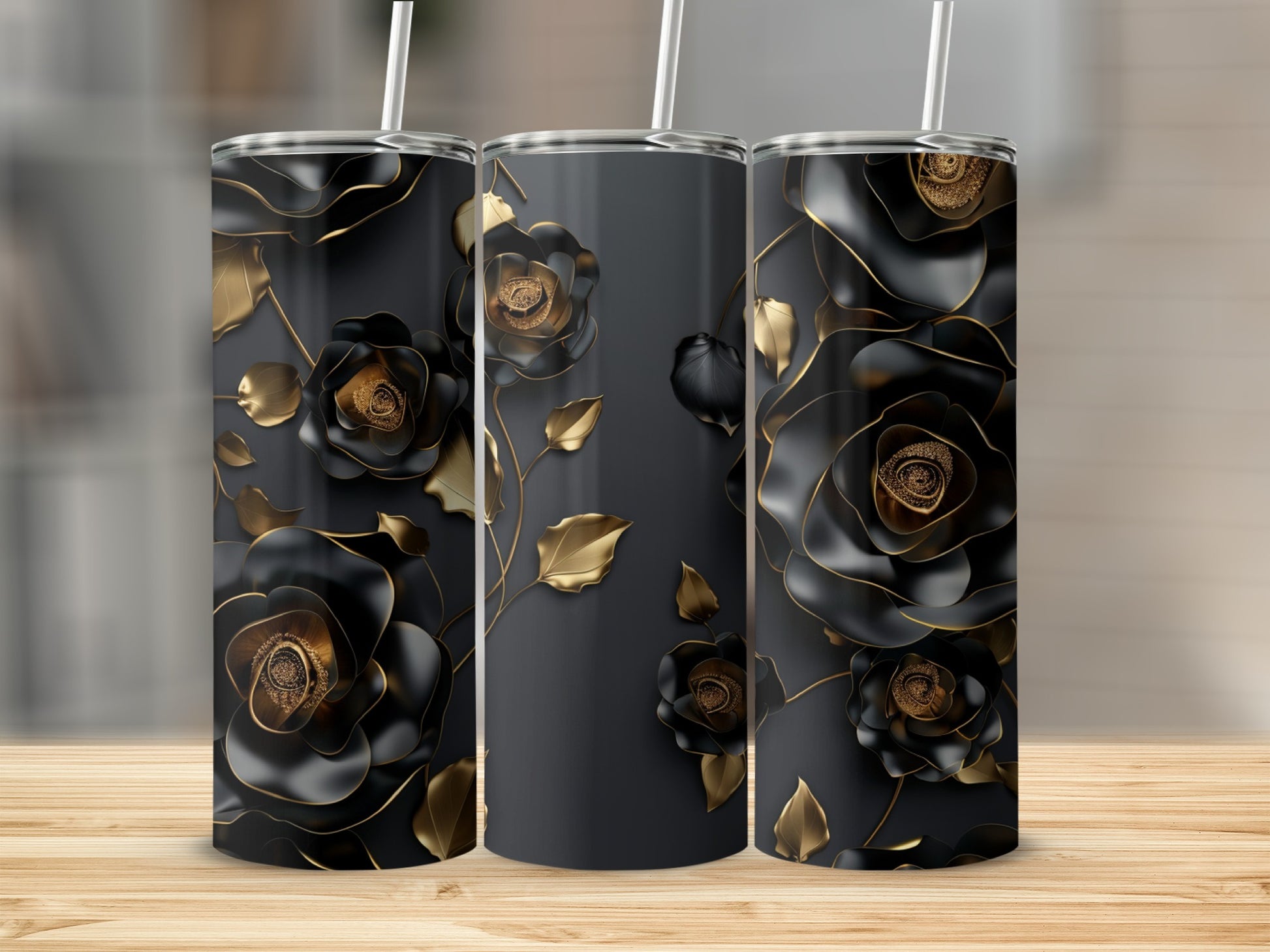 Three tall, dark gray tumblers with black and gold floral designs.