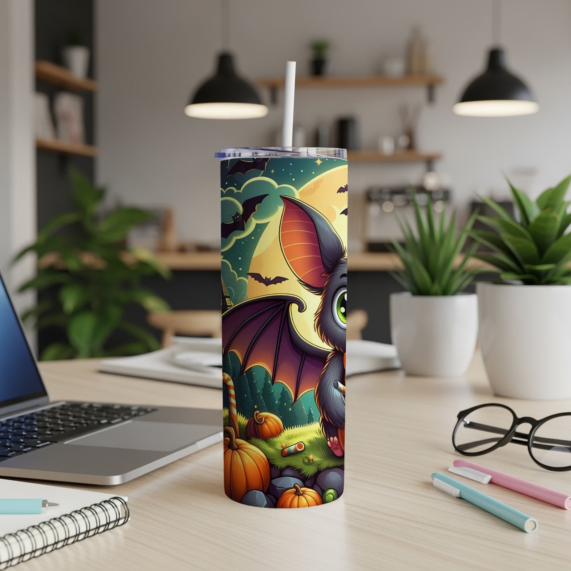 Tumbler with cartoon bat, pumpkins, and bats against a full moon night sky.