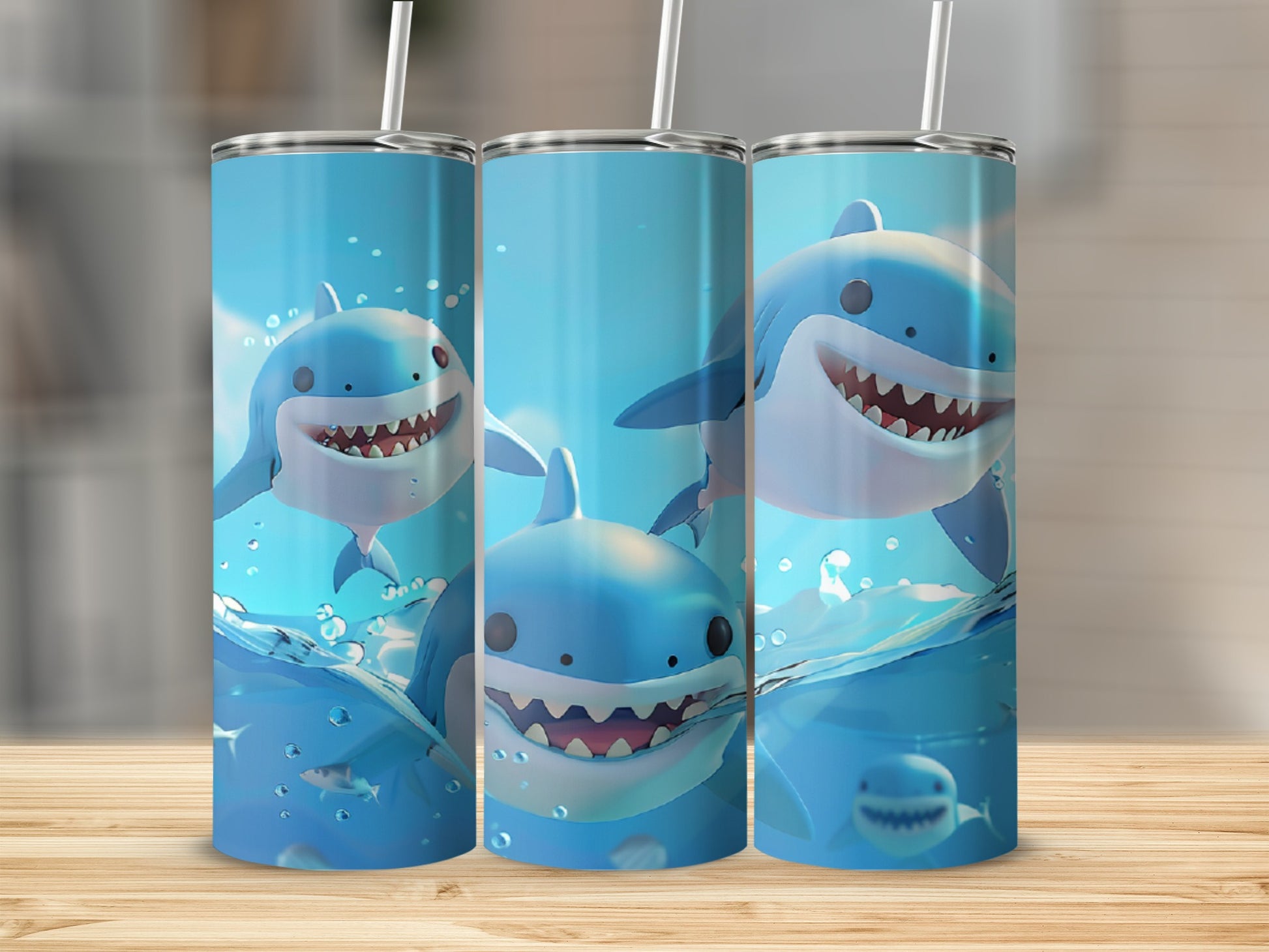 Three tumblers featuring cartoon sharks swimming in bubbly water.