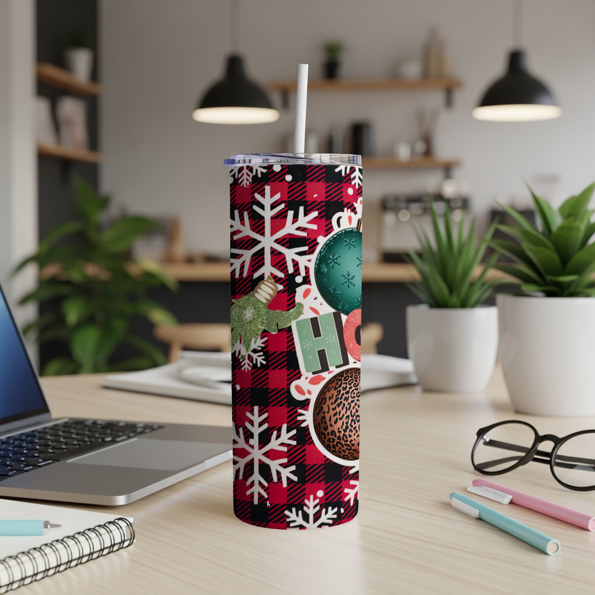 Christmas tumbler with plaid, snowflakes, ornaments, and "HO HO HO".
