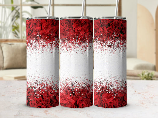 Three tumblers with red rose and glitter patterns on a marble surface.