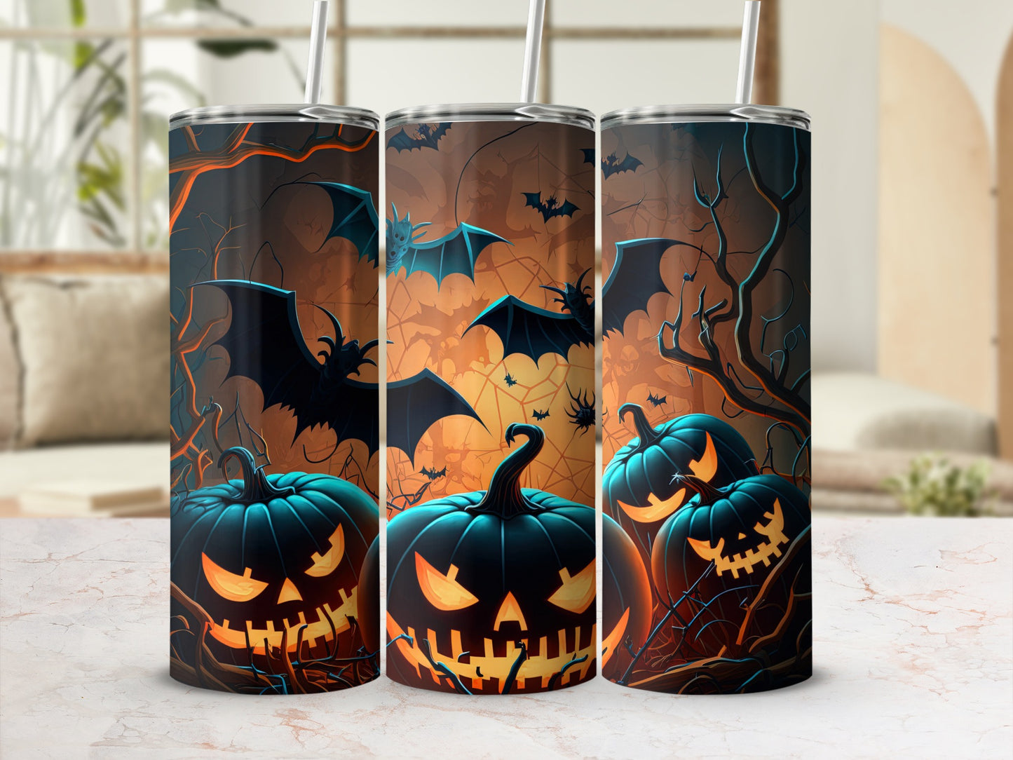 Three tumblers with a Halloween design featuring jack-o'-lanterns and bats.