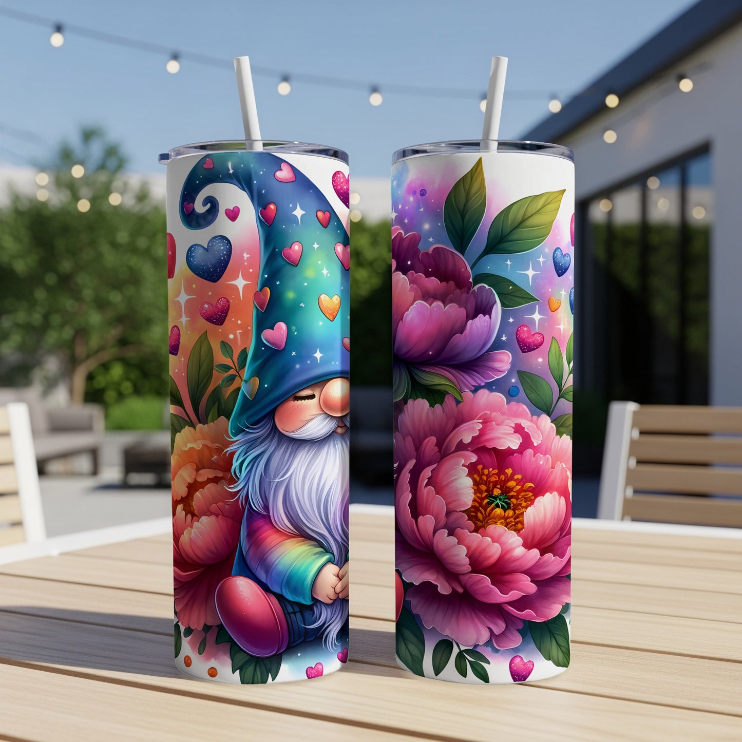 Two tumblers with a gnome and flowers design sit on a table.