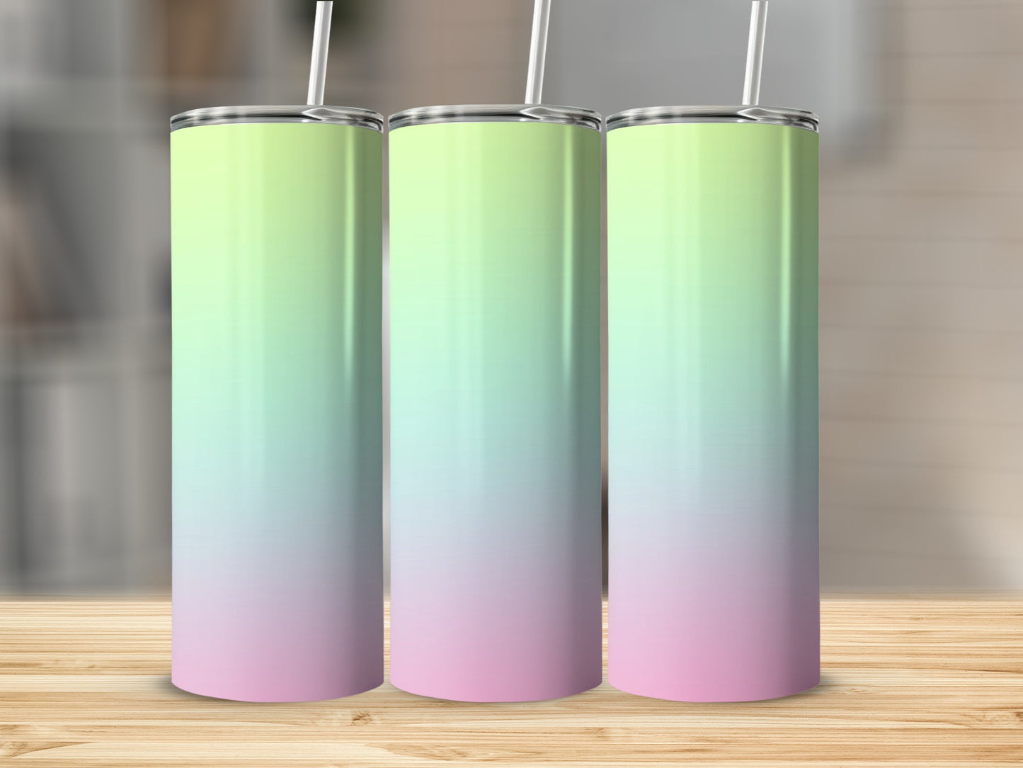 Three tall tumblers with pastel green to pink gradient