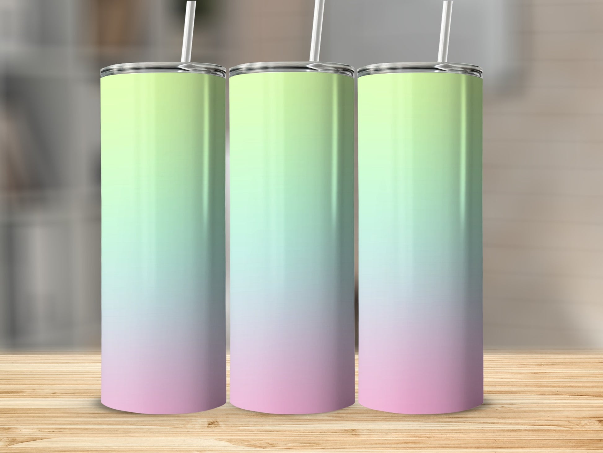 Three tall tumblers with pastel green to pink gradient