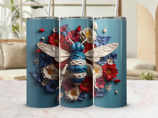 Blue tumbler with bee and floral design.