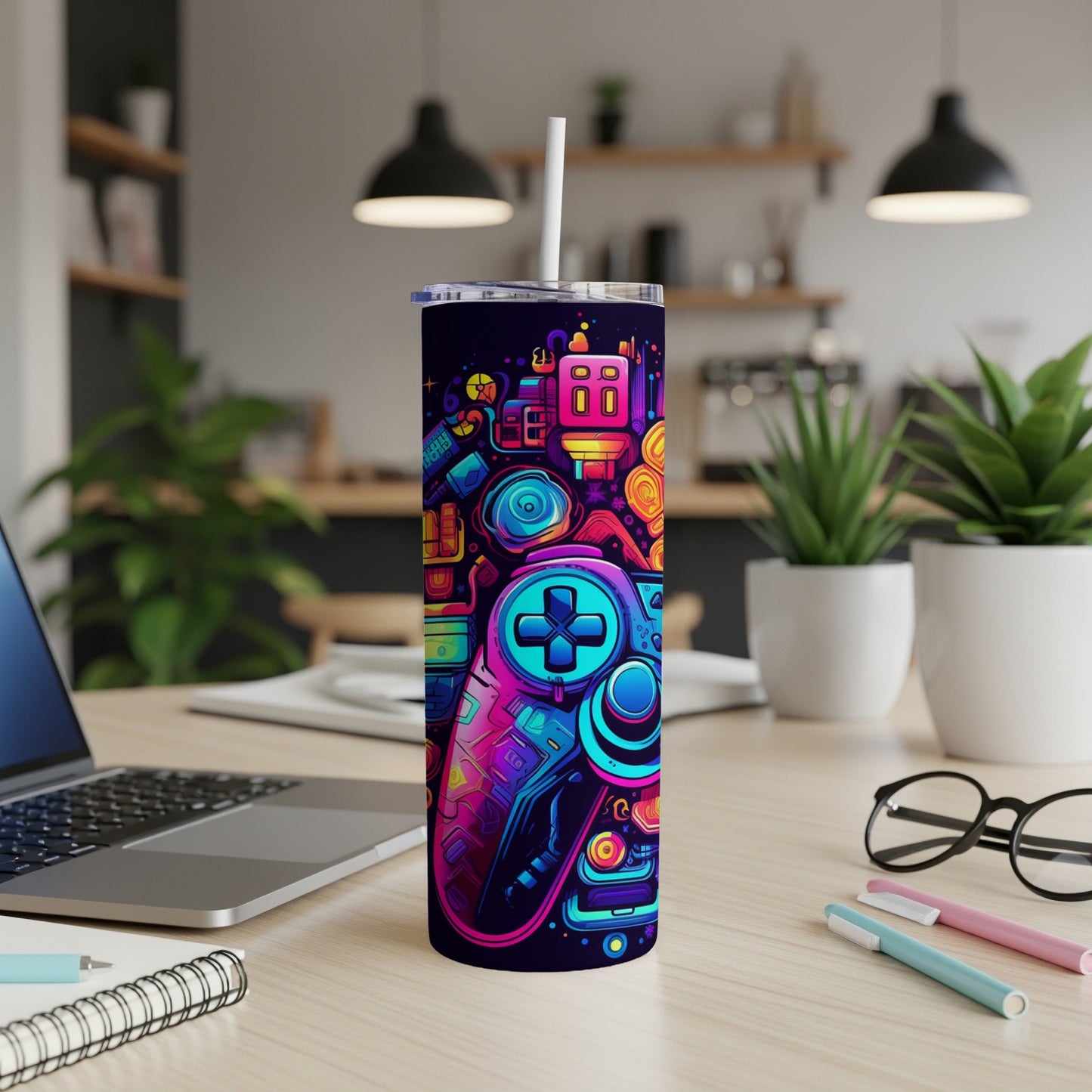 Gaming-themed tumbler with colorful controller graphics and a straw.