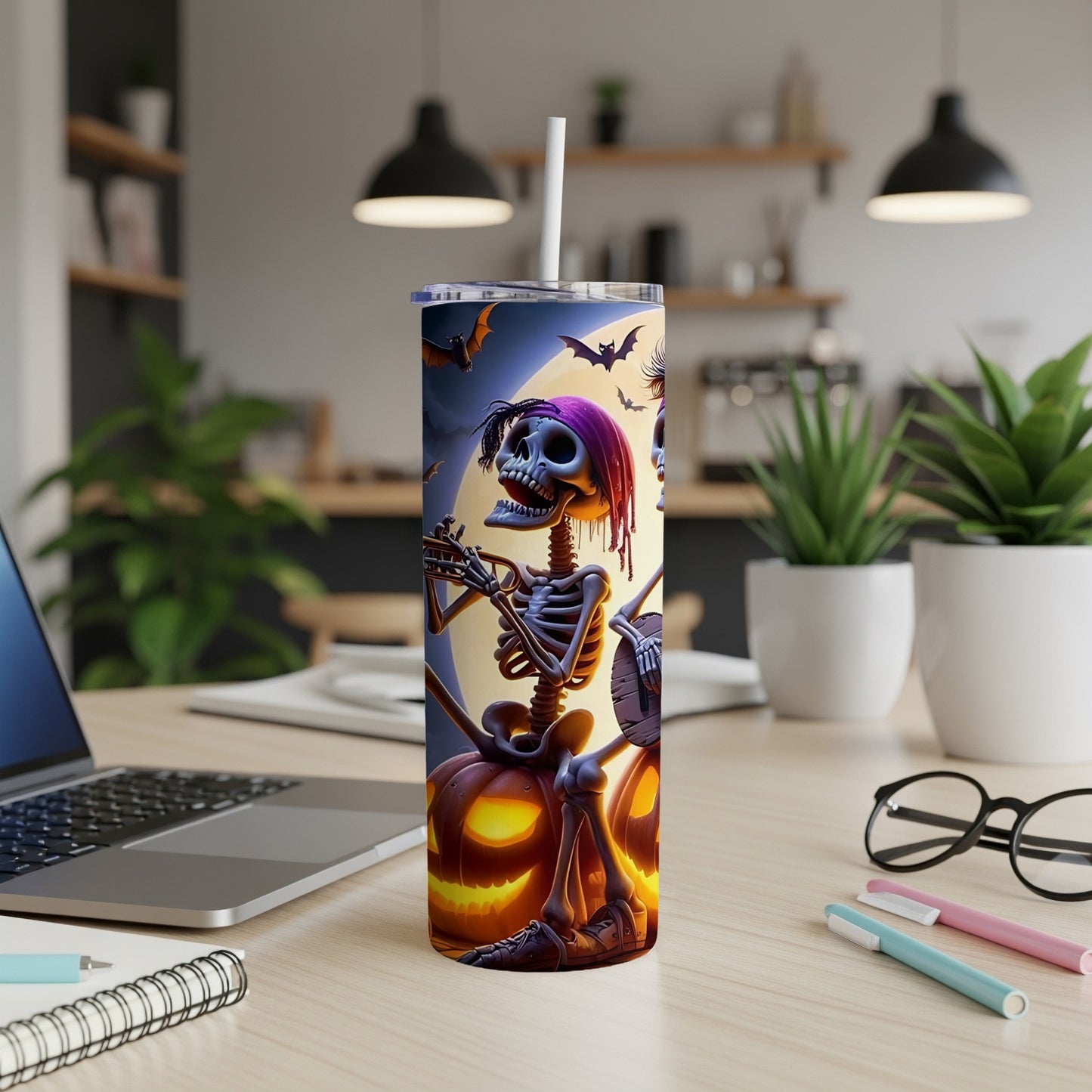Halloween tumbler with skeletons playing instruments against a moonlit sky.