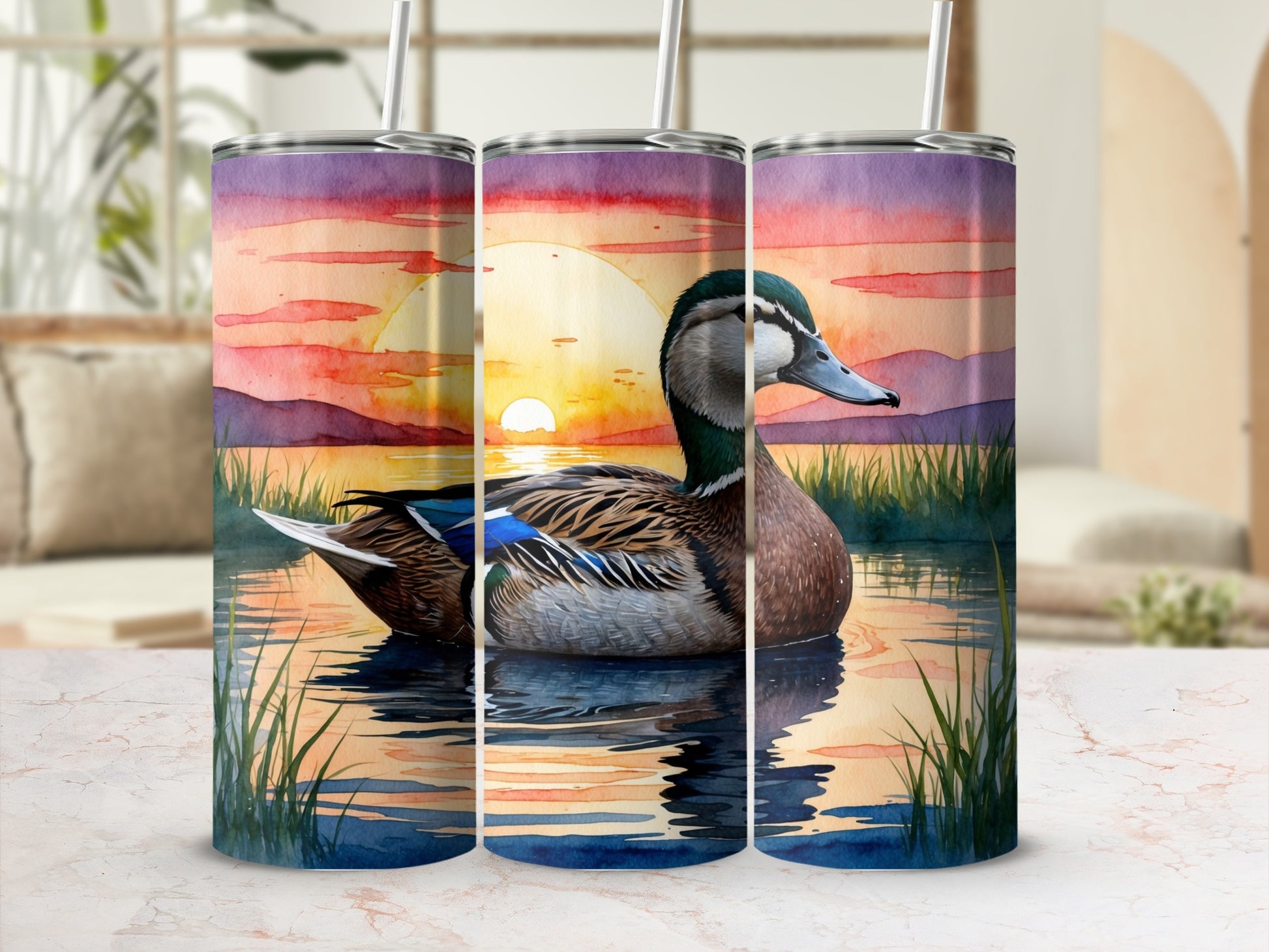 Mallard duck in sunset lake scene on three stacked tumblers.
