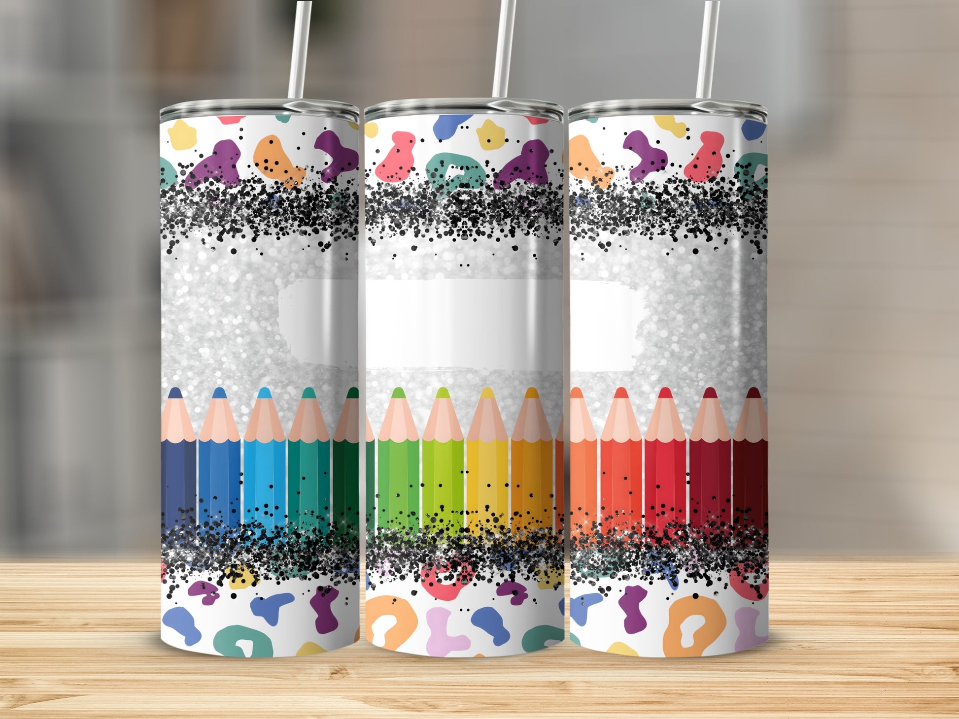 Colorful pencil pattern tumbler with glitter and abstract speckles.
