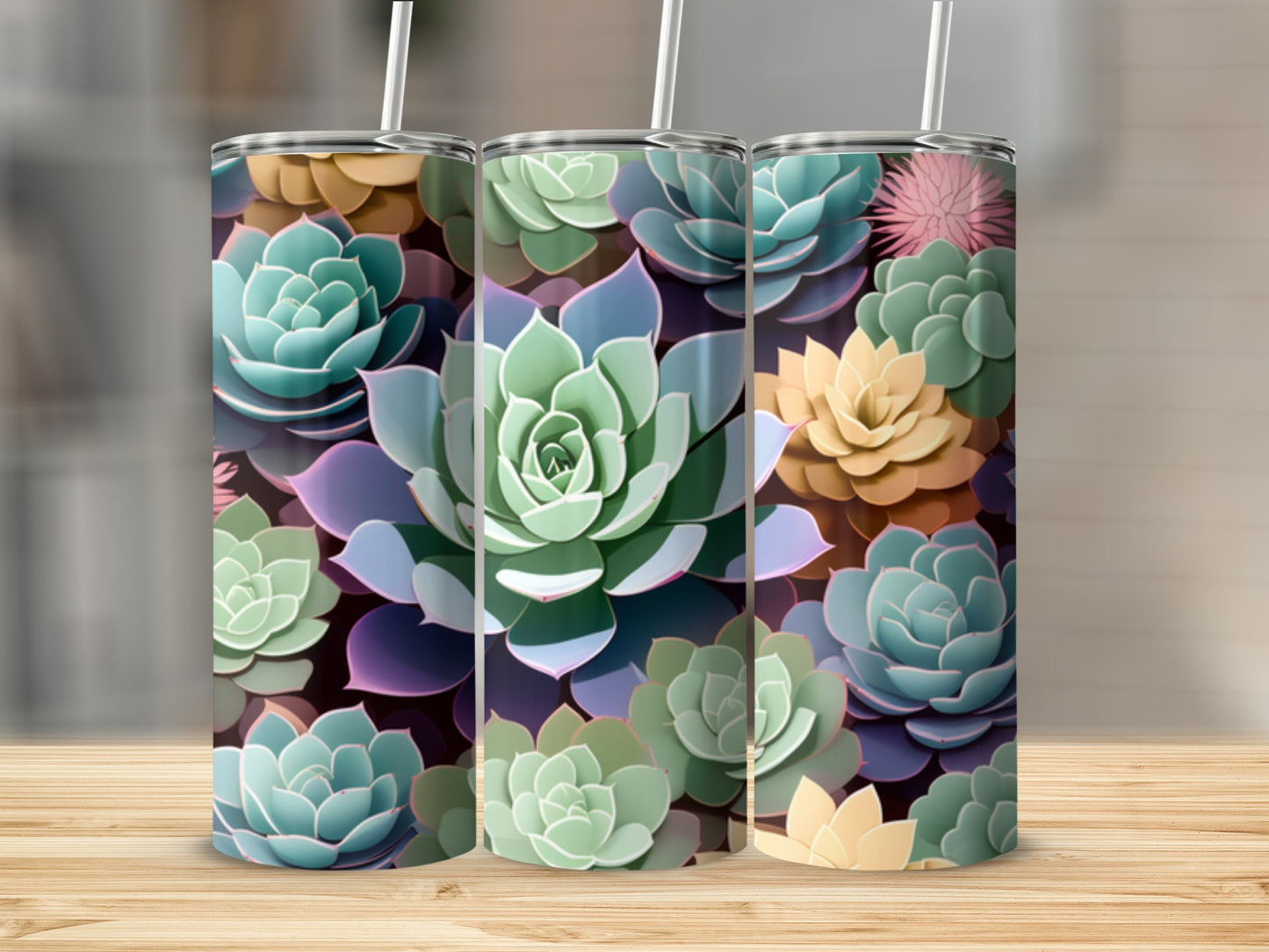 Three tumblers decorated with colorful succulent plant designs on a wooden surface.