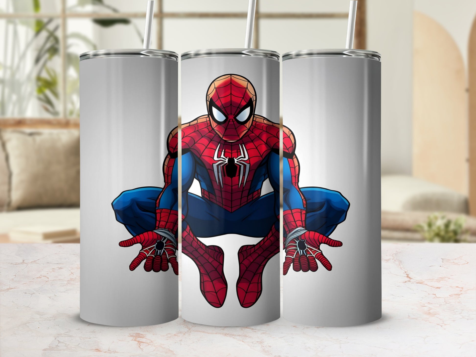 Spiderman crouching on a white tumbler with a straw.
