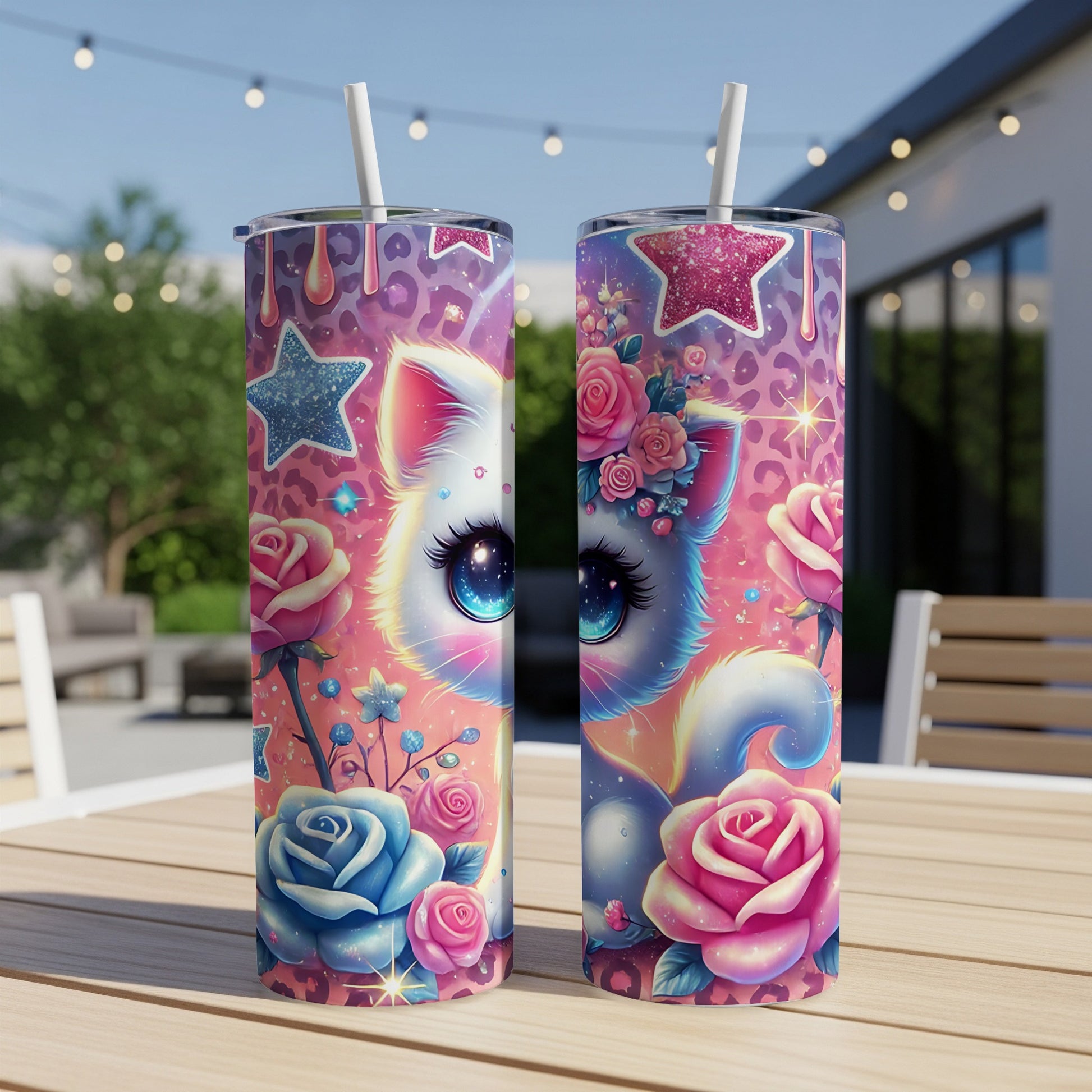 Two tumblers featuring a cartoon cat with large blue eyes surrounded by roses and stars.