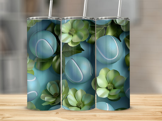 Three teal tennis balls and green floral accents on a skinny tumbler.