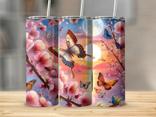 Three tumblers with cherry blossoms and butterflies against a sunset sky.