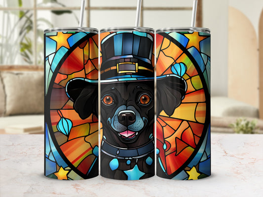 Black dog wearing a hat and stained glass background on a tumbler.