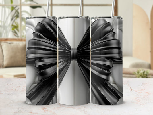 Three tumblers with black ribbon bow design on white background.