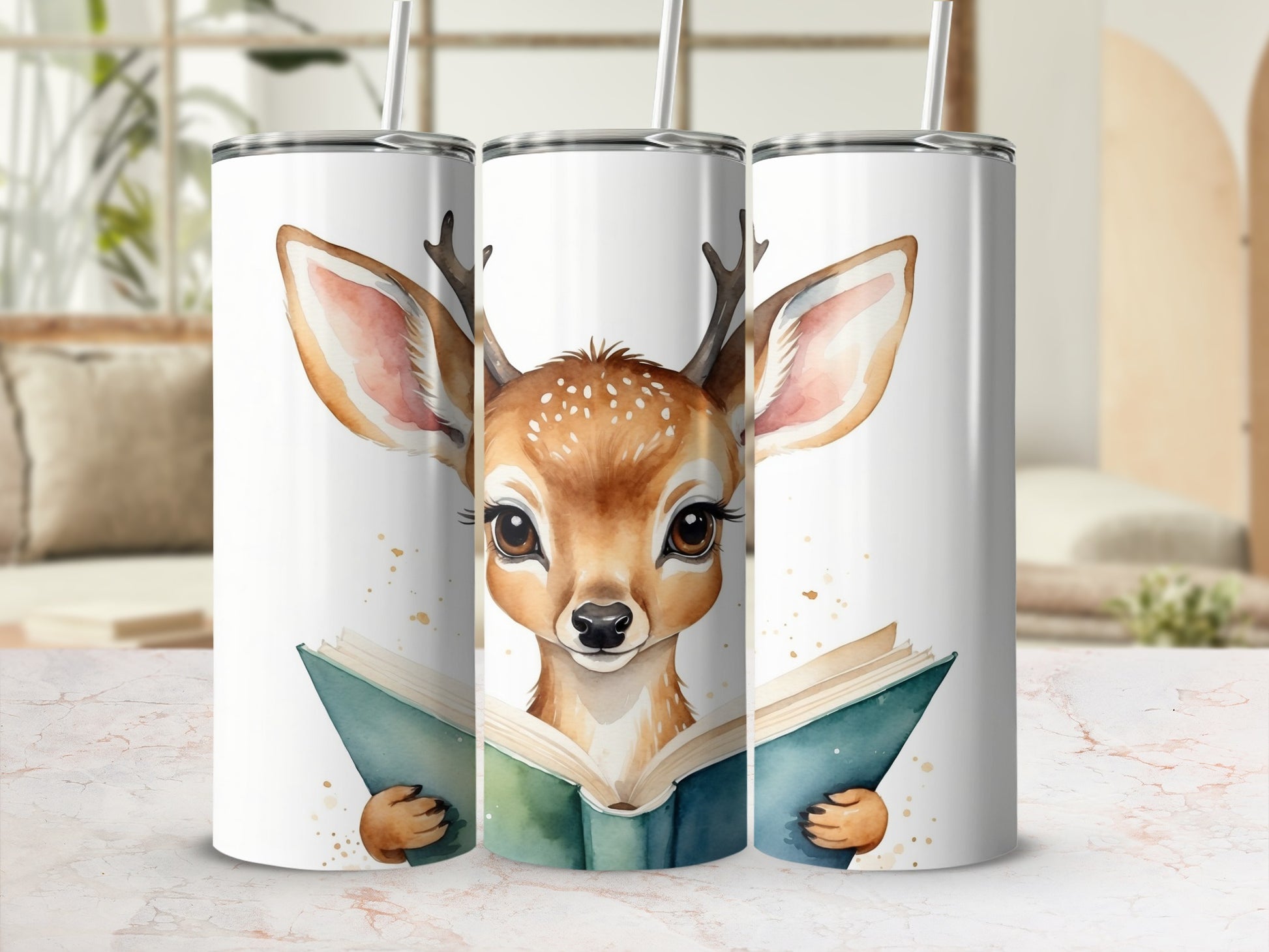 Deer reading a book, featured on three tumblers.