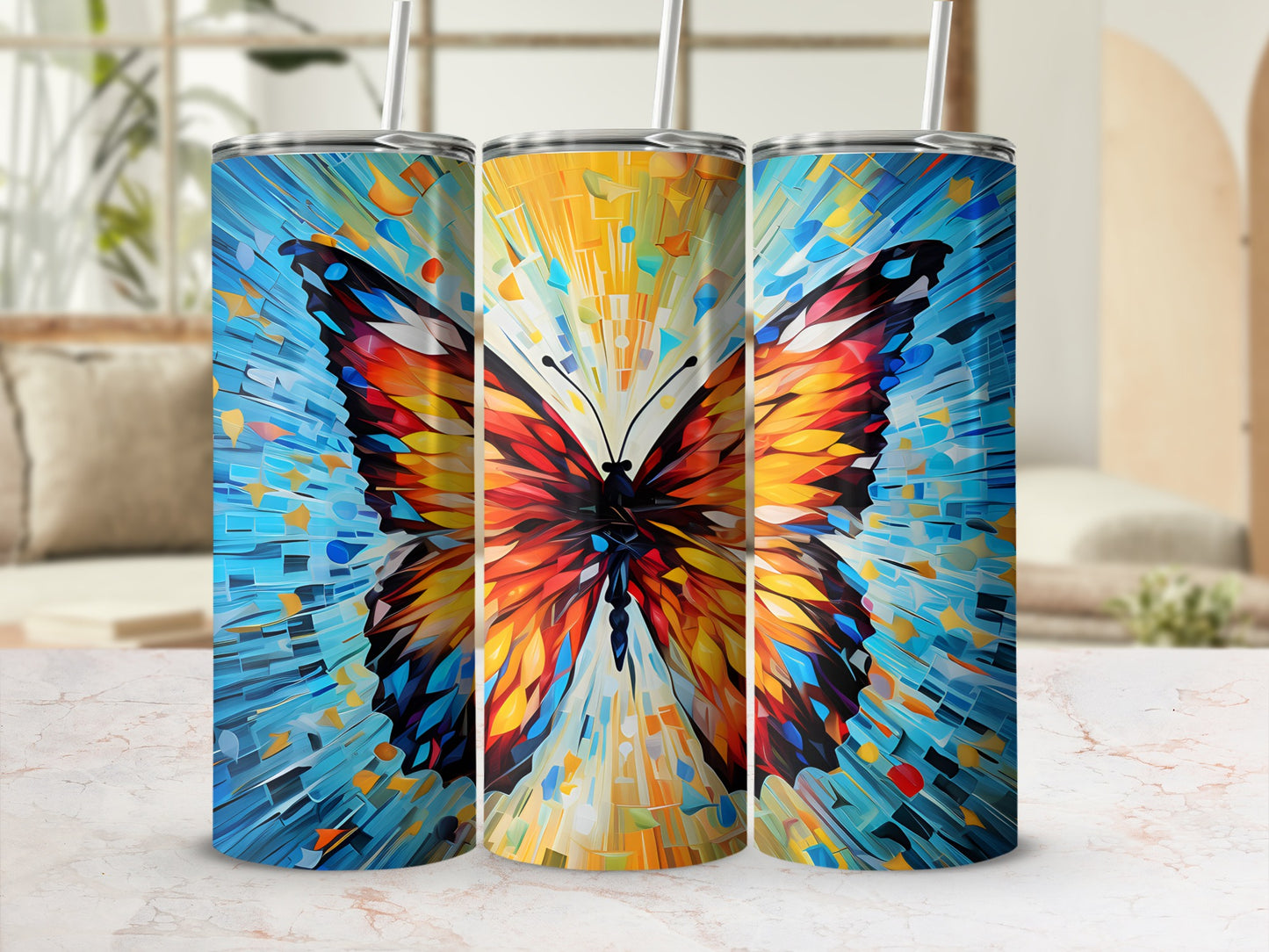Triptych of tumblers featuring a colorful mosaic butterfly design.
