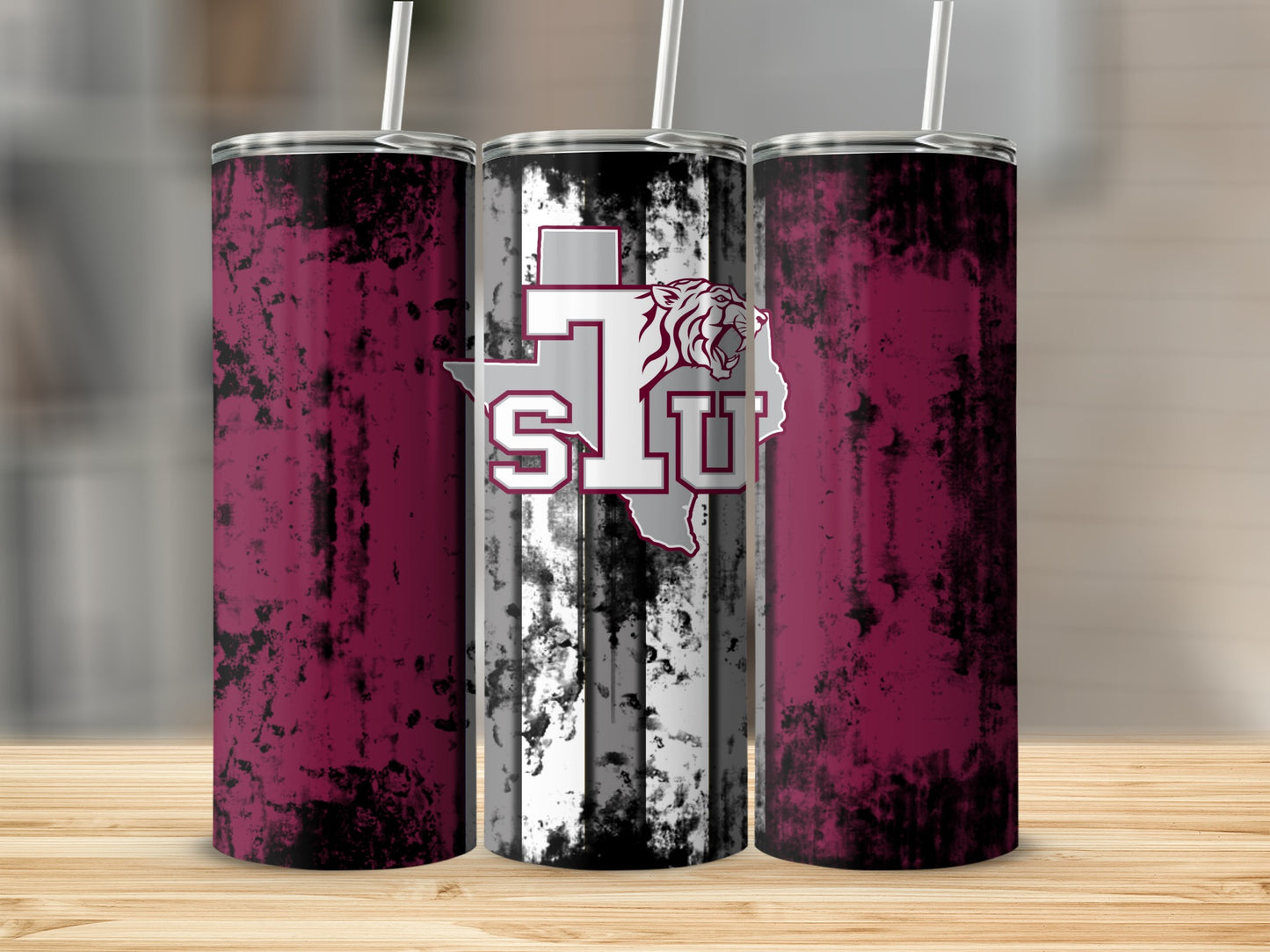 Three Texas State University tumblers with a distressed maroon and black design.