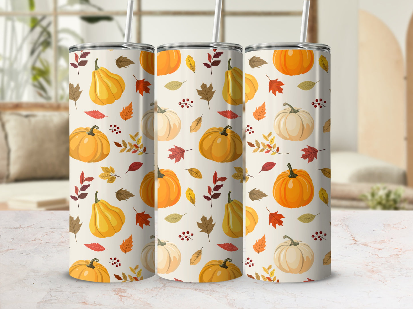 Three tumblers with a fall pumpkin and leaf pattern.
