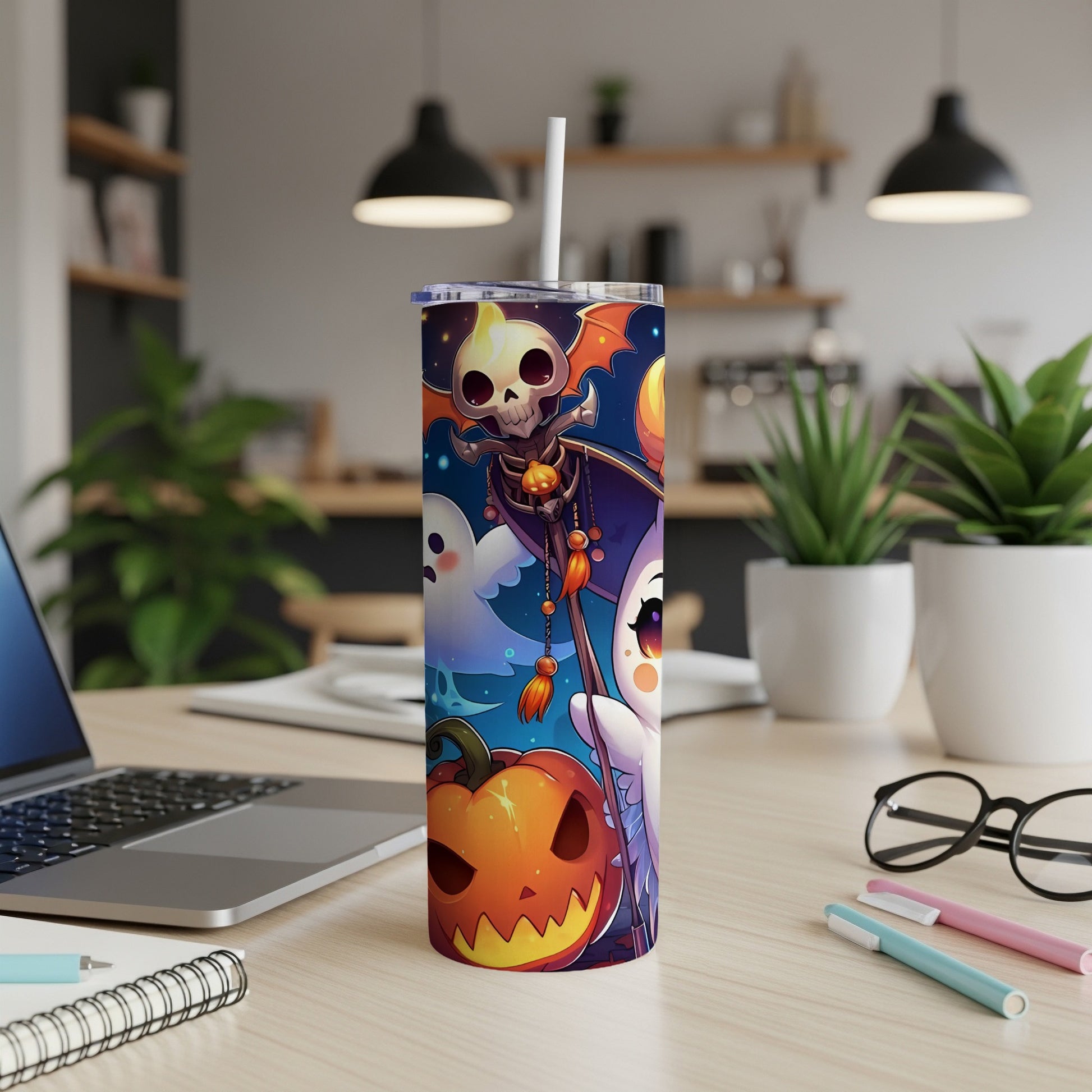 Tumbler with Halloween-themed art featuring a skeleton, ghosts, and a pumpkin.