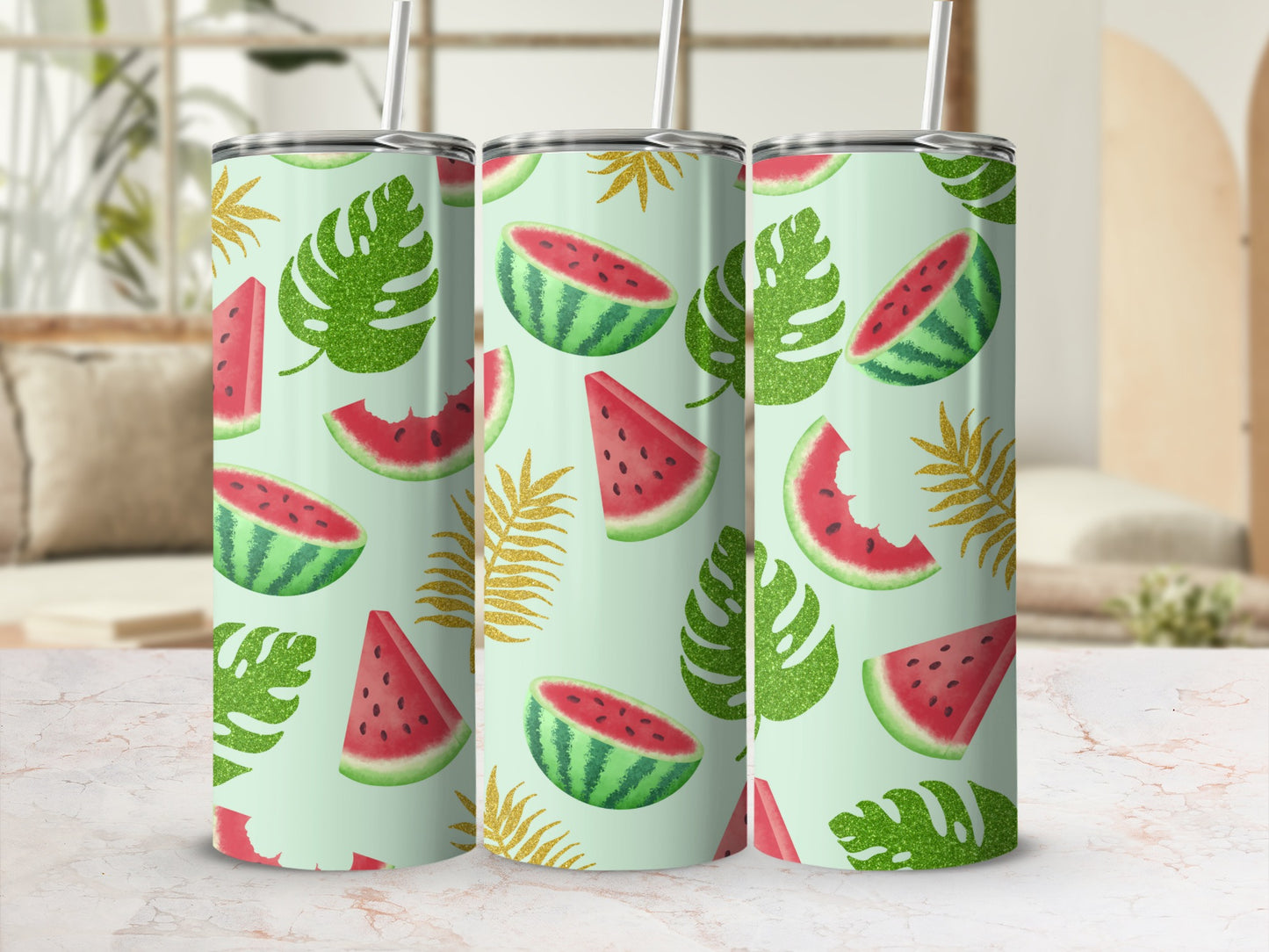 Three tumblers with watermelon slices and glitter palm leaves on a light green background.
