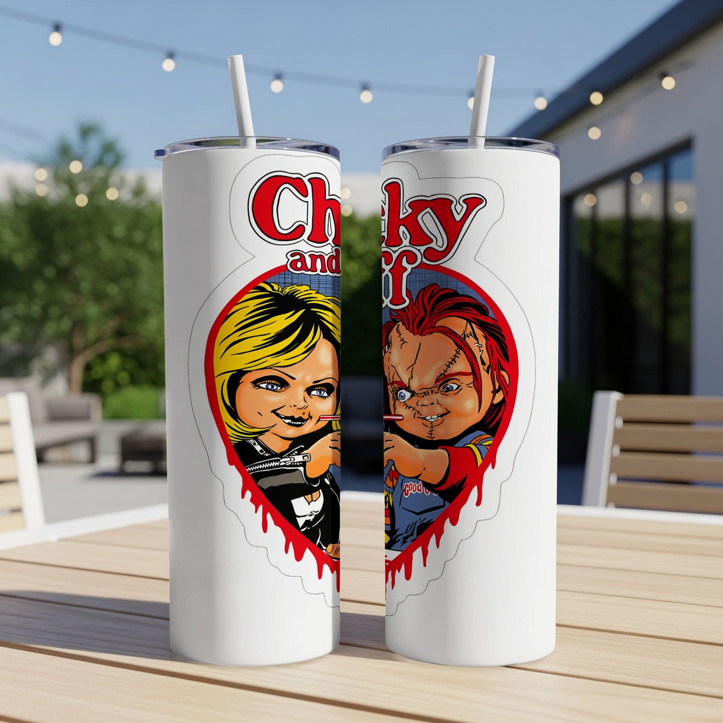 White tumblers featuring Chucky and Tiffany artwork with red dripping heart designs.