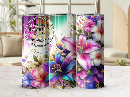 Three tumblers with floral designs and inspirational text, "You are beautifully made."