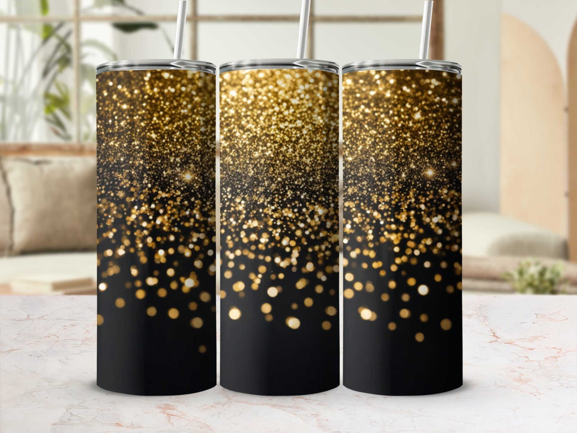 Three tumblers with black bases and gold glitter sparkle accents.