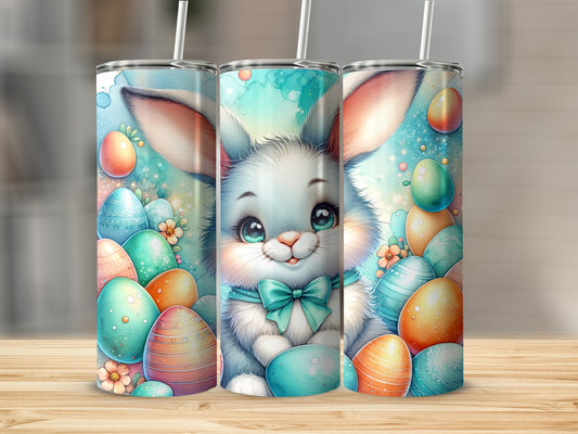 Cute Easter bunny with colorful eggs and flowers on a tumbler.