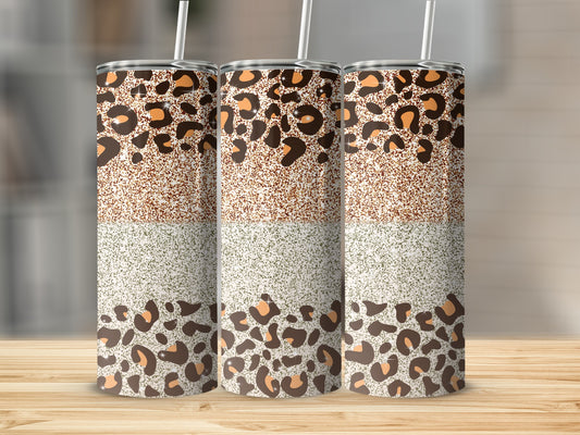 Three tumblers with leopard print and glitter patterns.