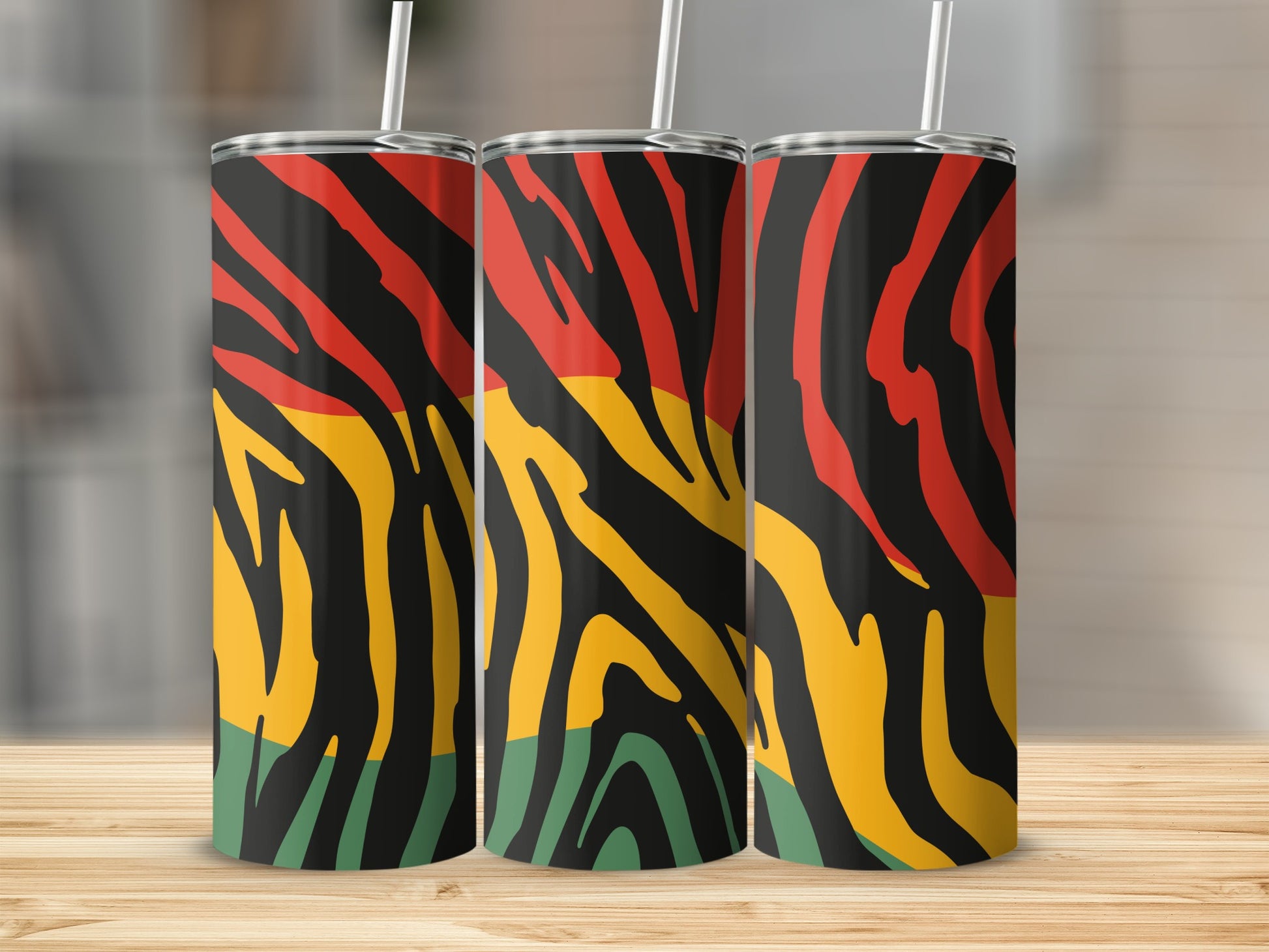 Three tumblers with a black, red, yellow, and green stripe pattern.