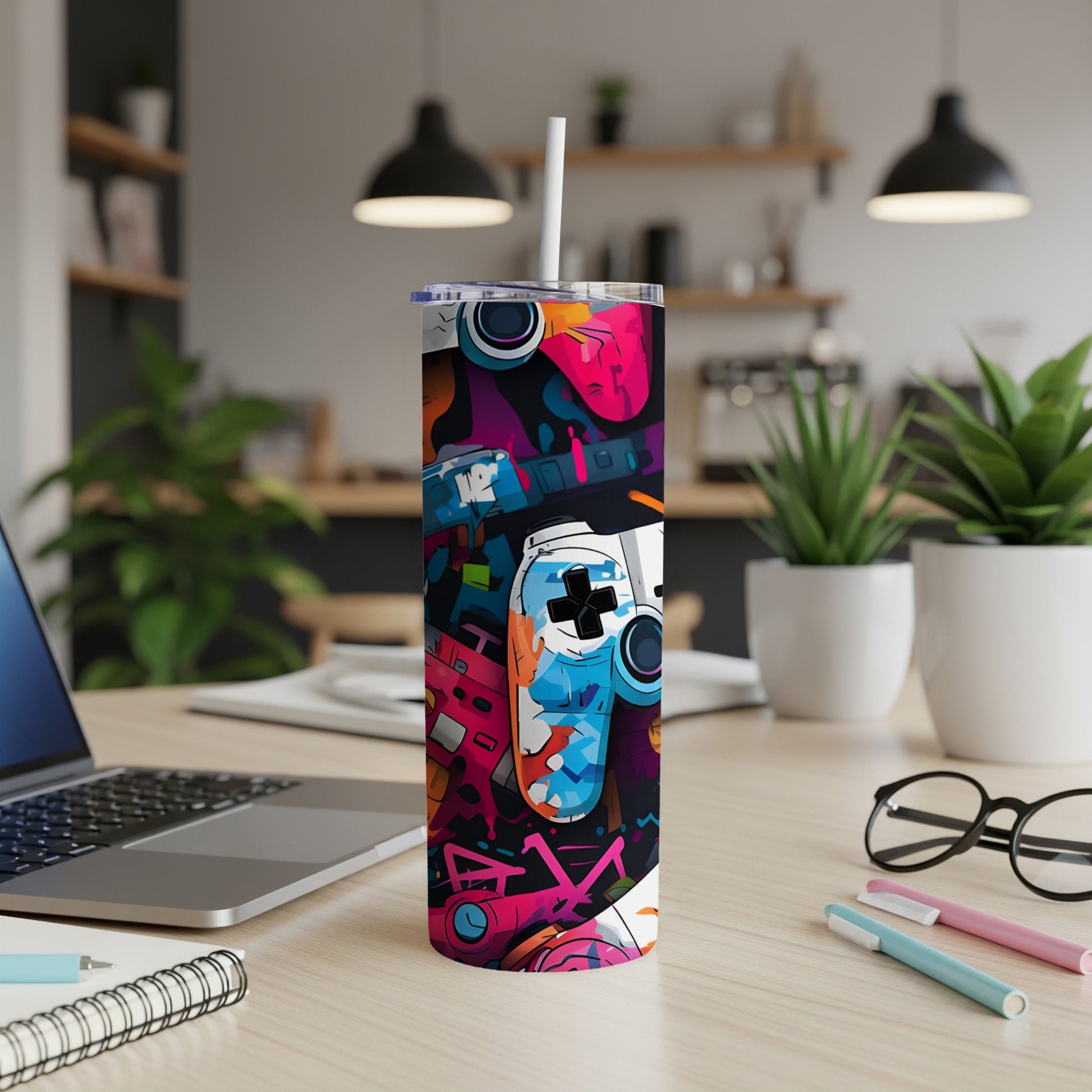 Tall, colorful tumbler with gaming controller and button graphics.