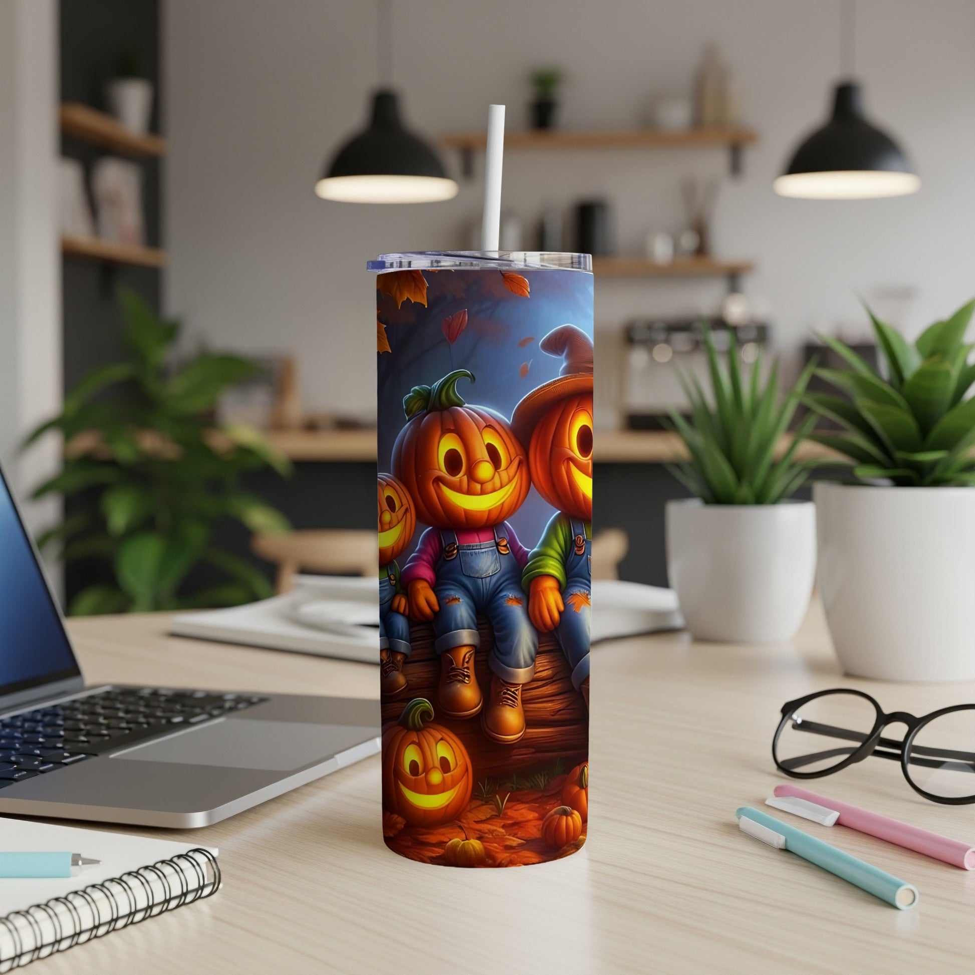 Tumbler with smiling cartoon pumpkins wearing overalls and hats.