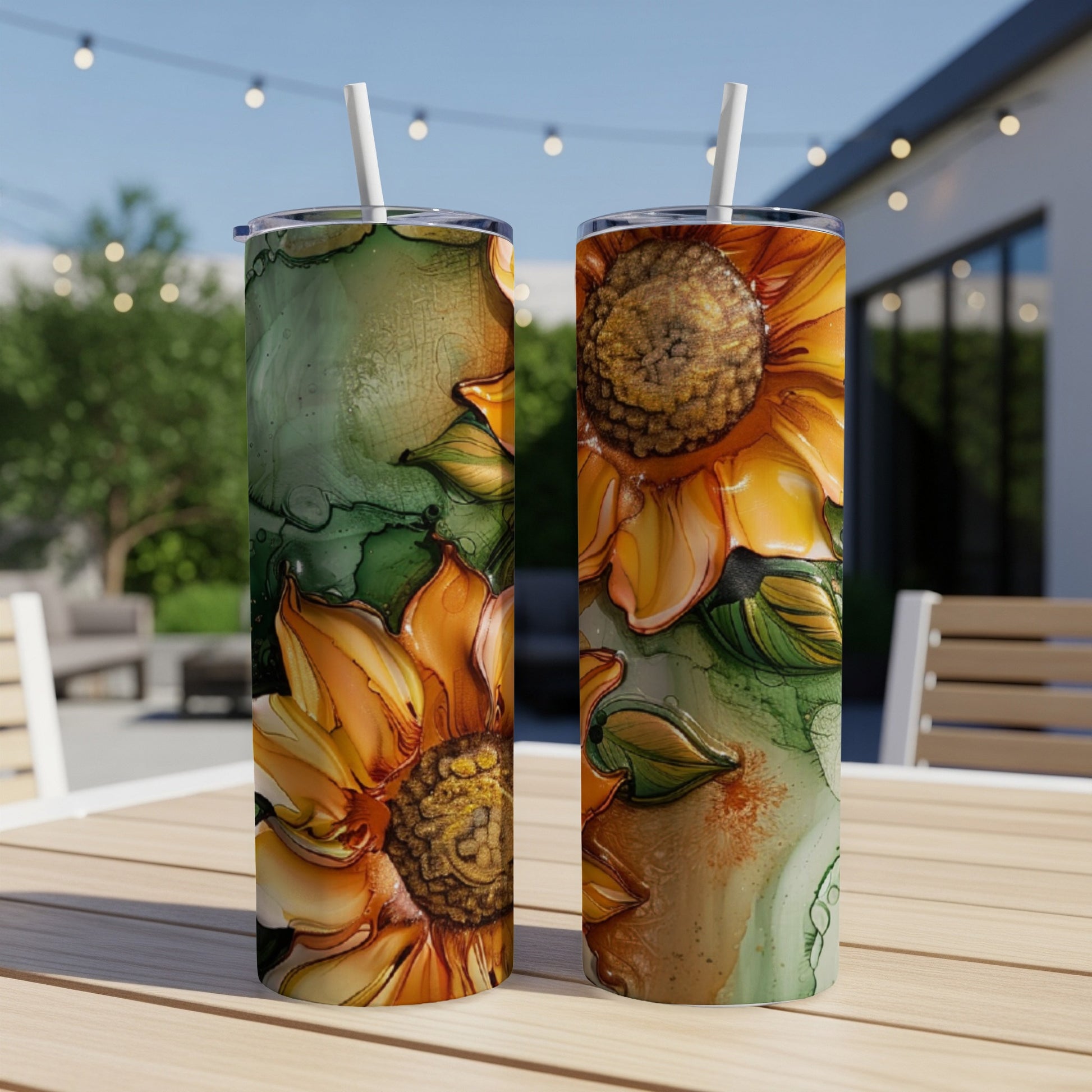Two tumblers with vibrant sunflower and green ink art designs.