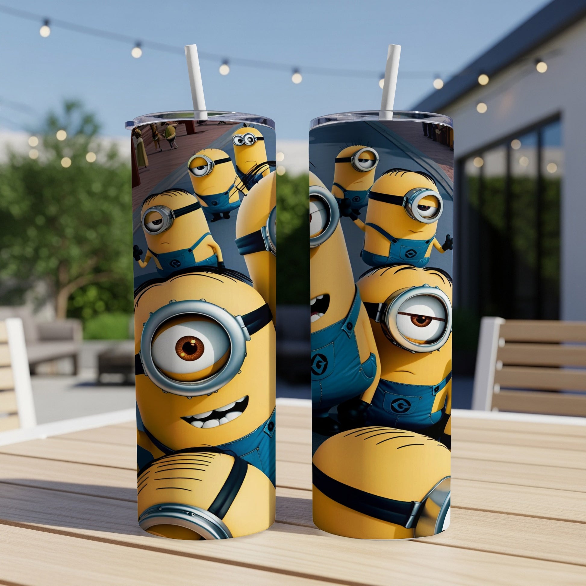 Two Minions tumblers with straw on a wooden table.