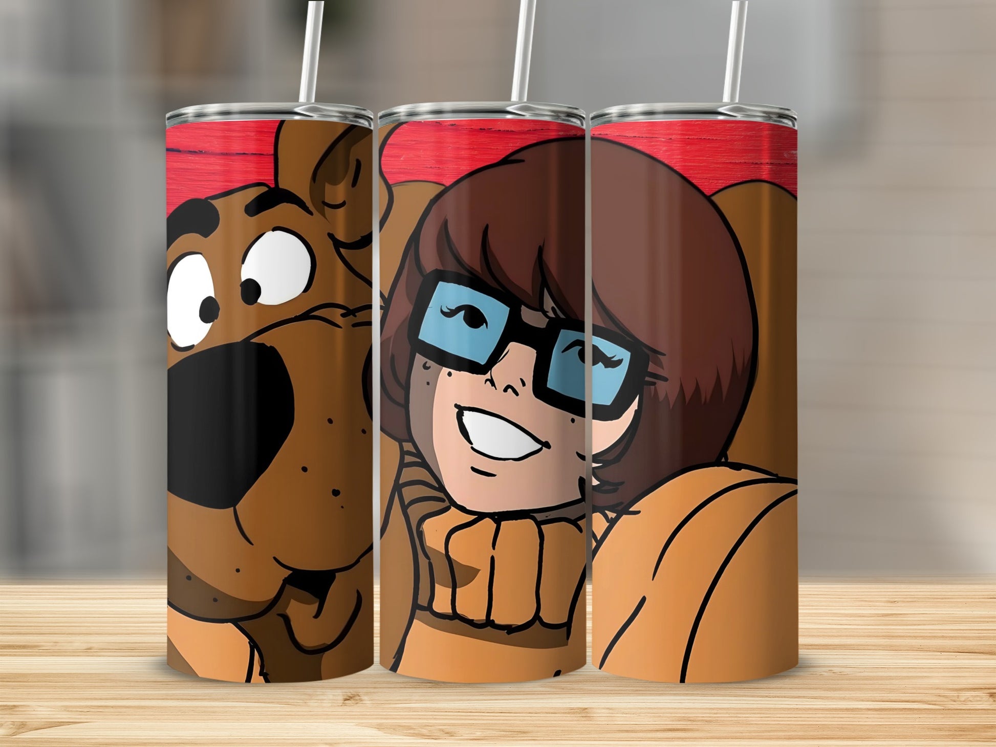 Scooby-Doo and Velma characters on red patterned tumblers.