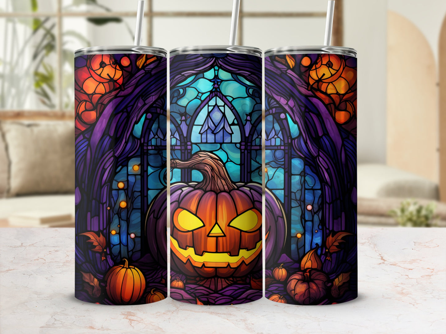 Three Halloween tumblers with carved pumpkins and stained glass designs.