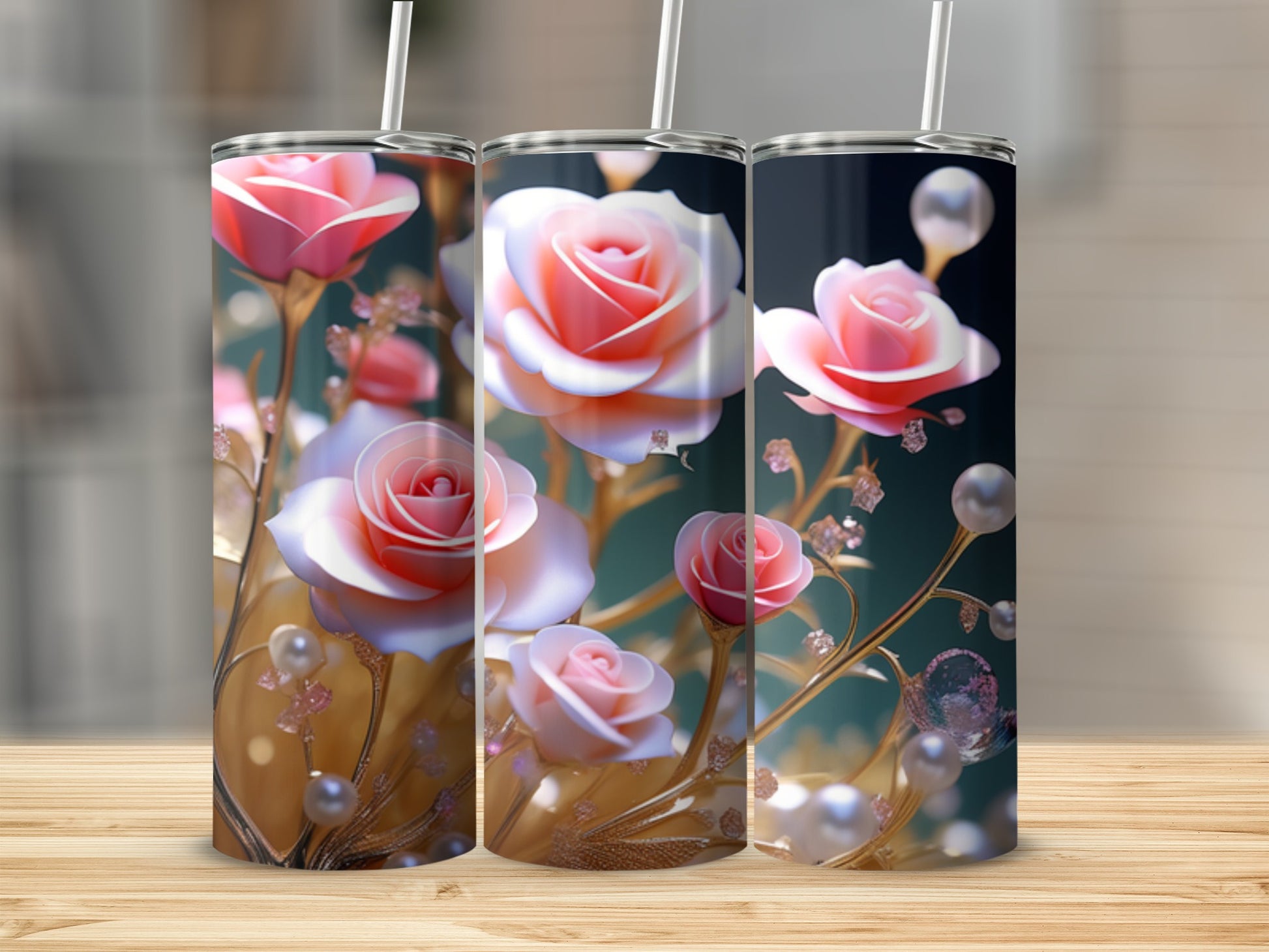 Three tumblers with pink roses, pearls, and gold accents on a wooden surface.