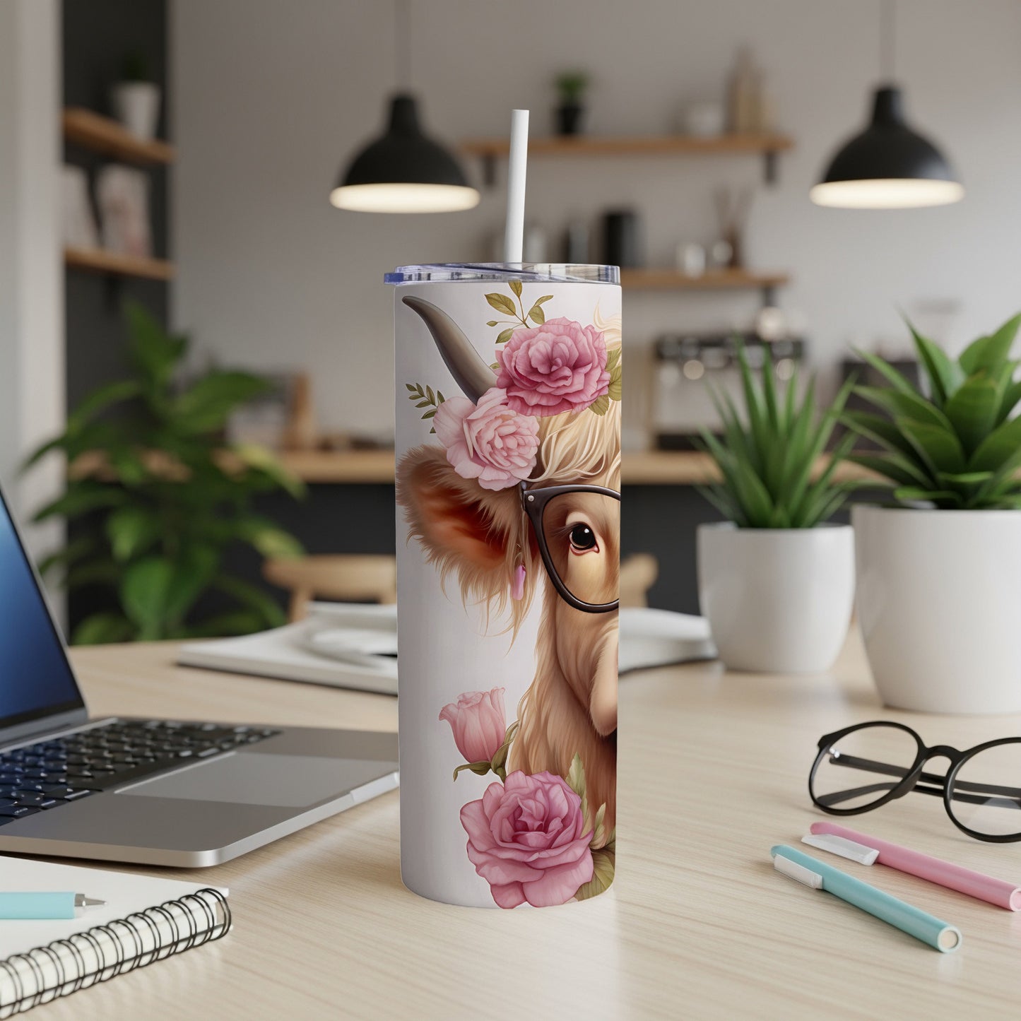 Highland cow tumbler with flowers and glasses, white lid and straw.