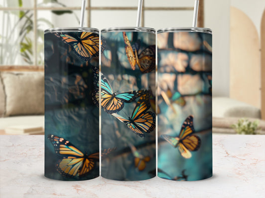 Three tumblers featuring realistic monarch butterflies on a blurred background.