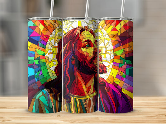 Stained glass depiction of Jesus' face with colorful halo and striped straw.