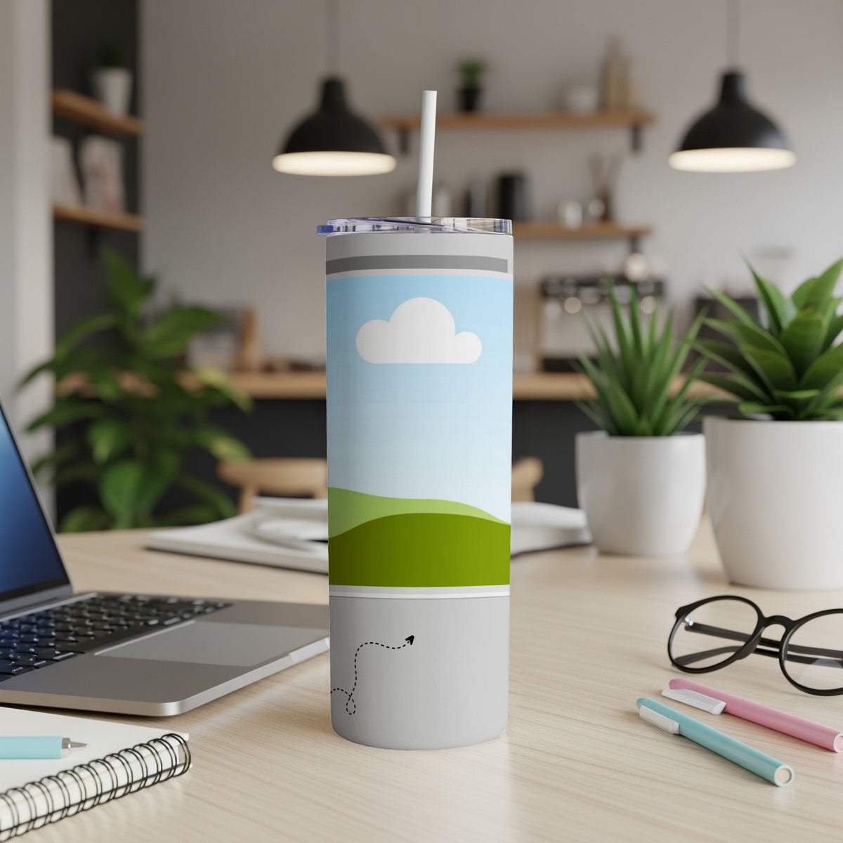 Gray tumbler with a scenic design of a cloud, sky, and rolling hills.