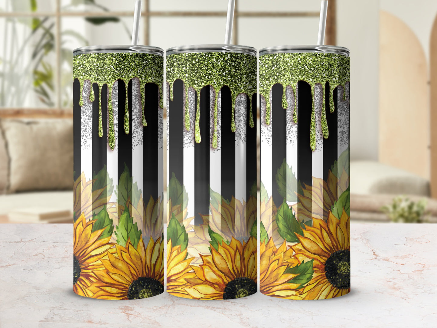 Three sunflowers with glitter dripping down striped tumblers.