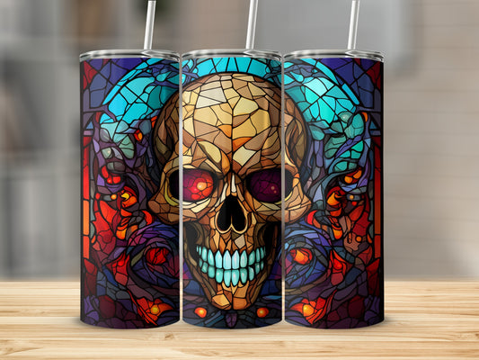 Stained glass skull tumbler with blue, red, and orange accents.